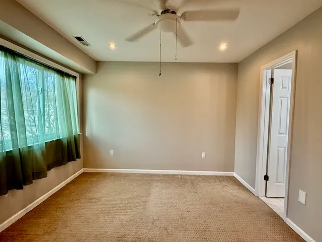 a room with a closet and wooden floor