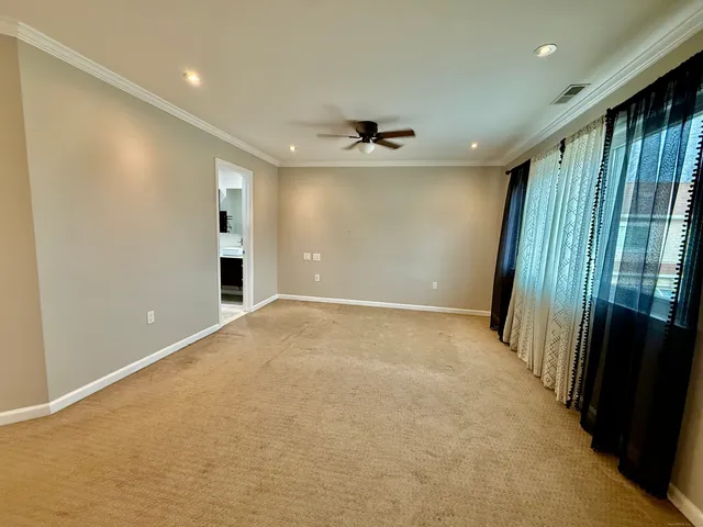 a bathroom with a sink a toilet a mirror and vanity