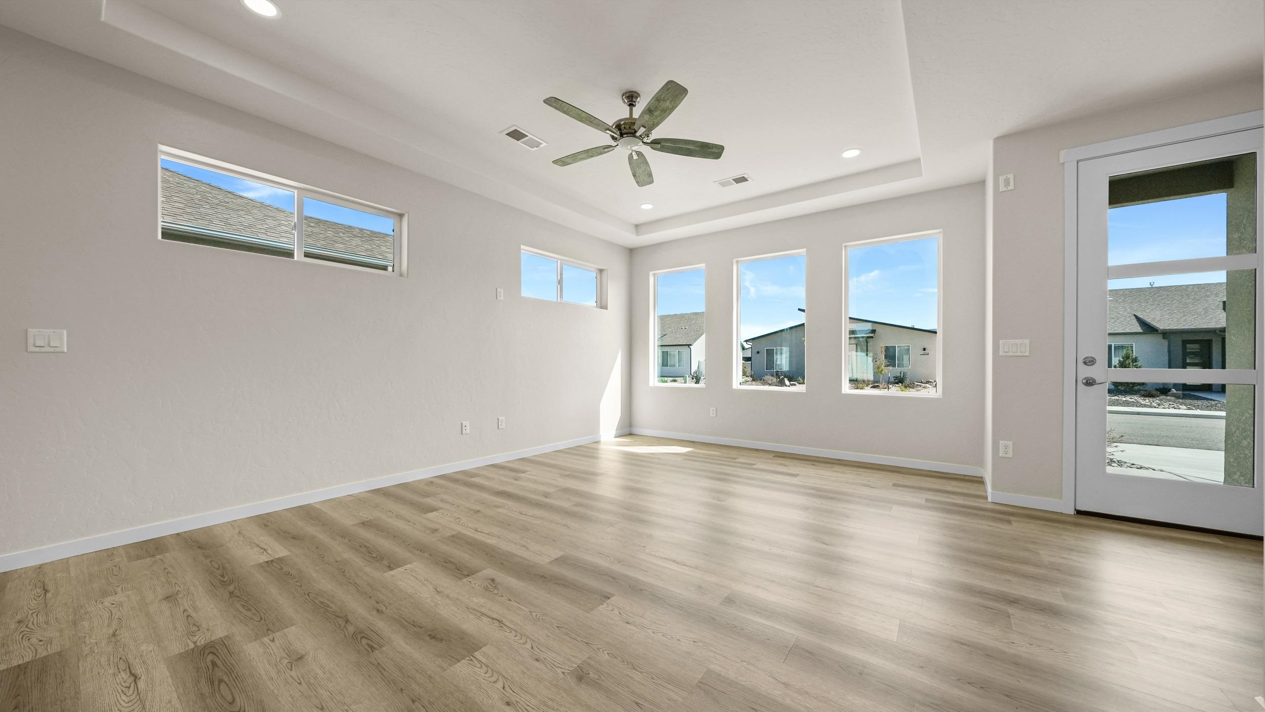 1705 Tungsten Way Fruita, CO 81521 - Photo 14 of 34 wooden floor in an empty room with a window