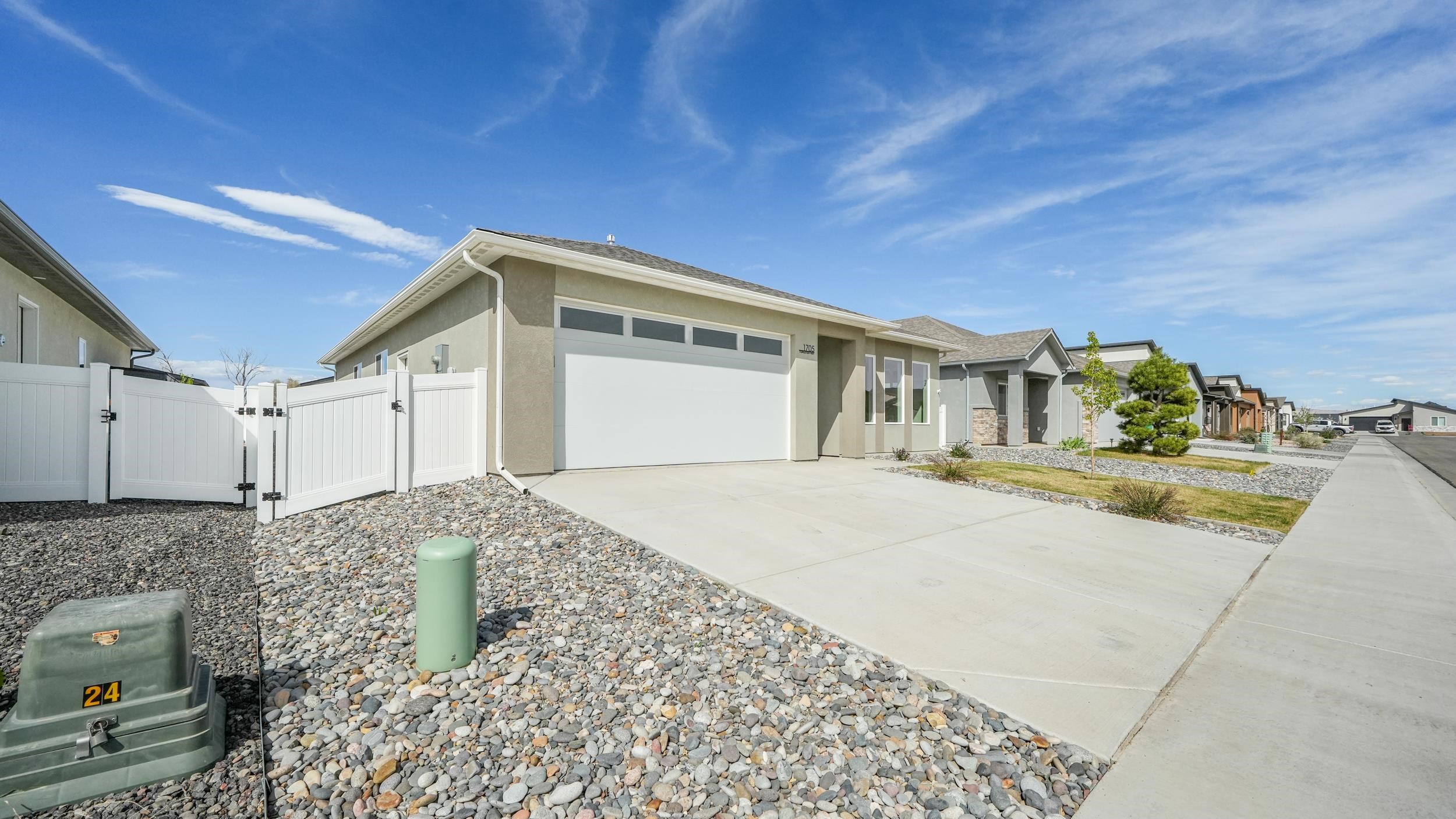 1705 Tungsten Way Fruita, CO 81521 - Photo 2 of 34 a front view of a house with a yard