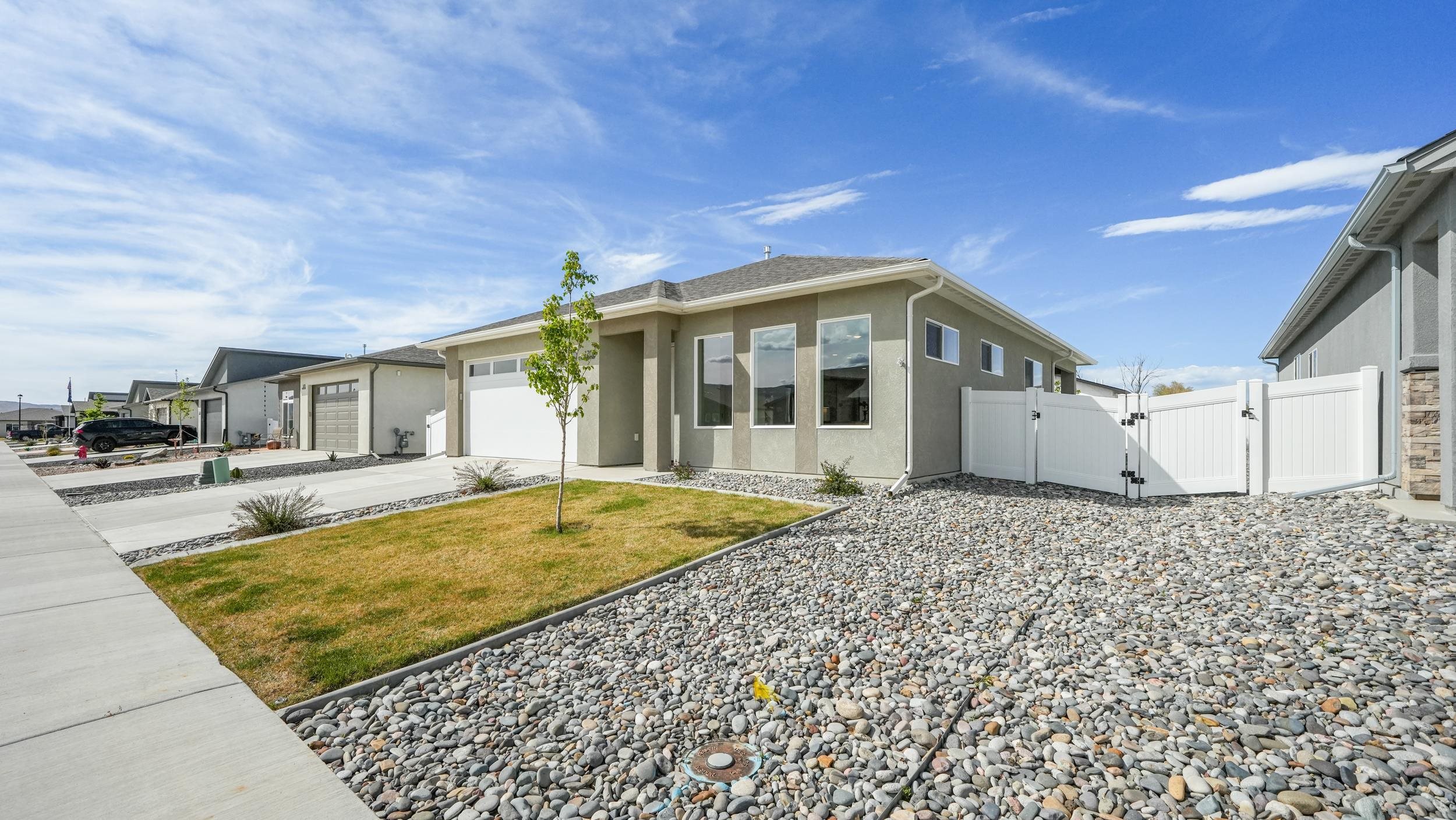 1705 Tungsten Way Fruita, CO 81521 - Photo 3 of 34 a front view of a house with a yard