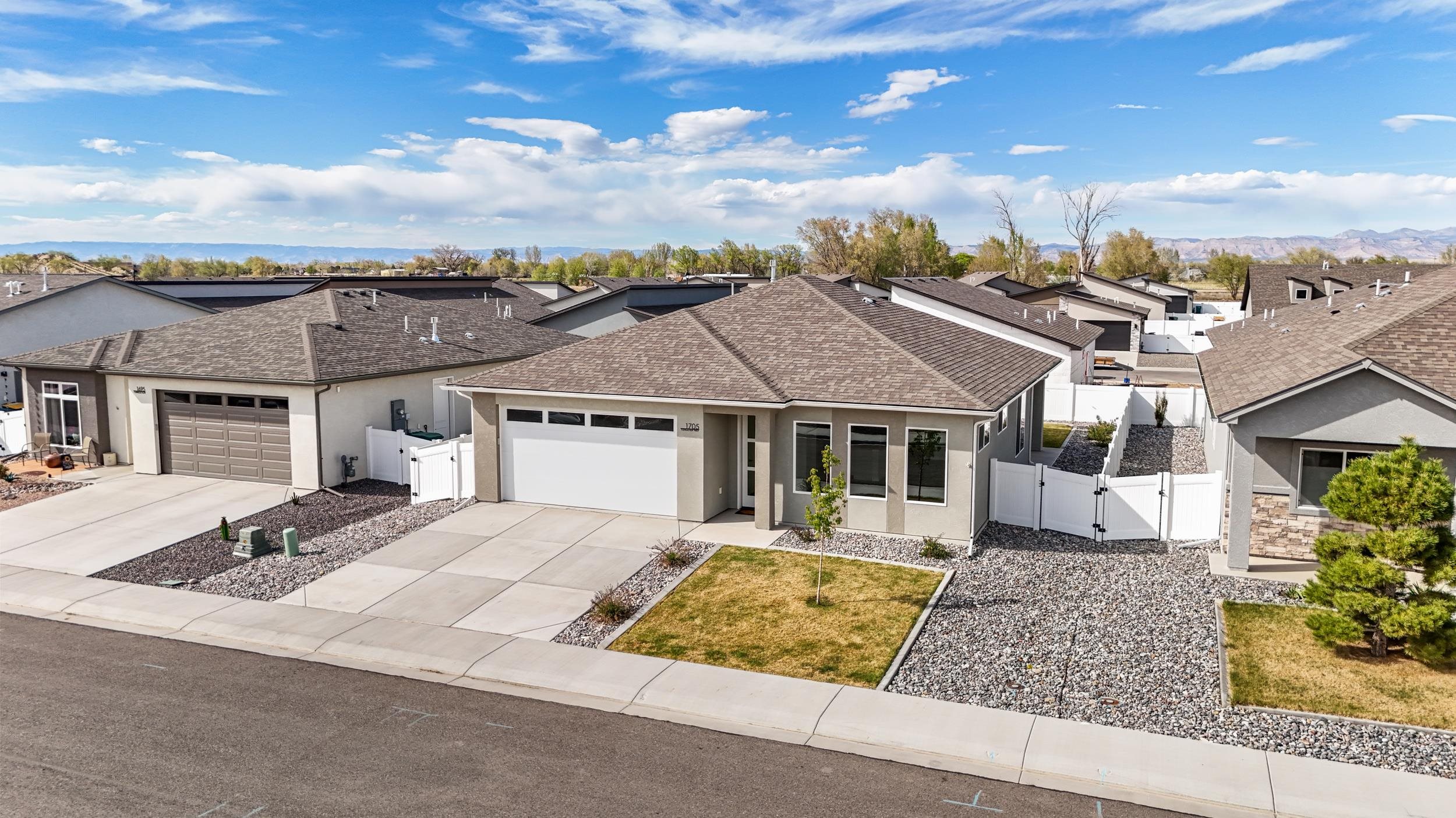 1705 Tungsten Way Fruita, CO 81521 - Photo 31 of 34 front view of a house with a yard