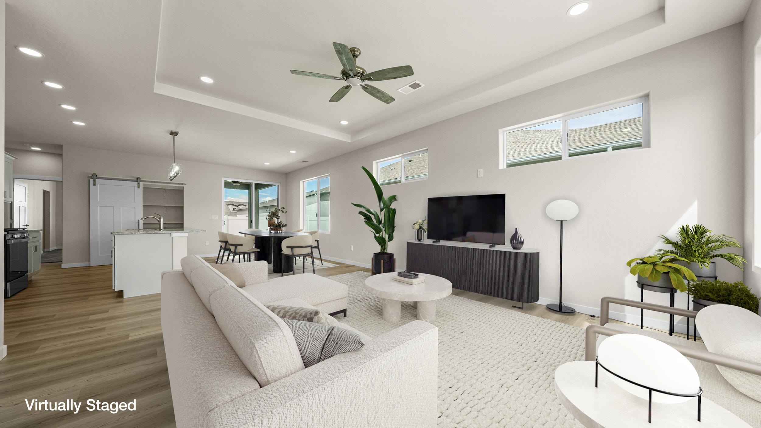 1705 Tungsten Way Fruita, CO 81521 - Photo 6 of 34 a living room with furniture and a flat screen tv