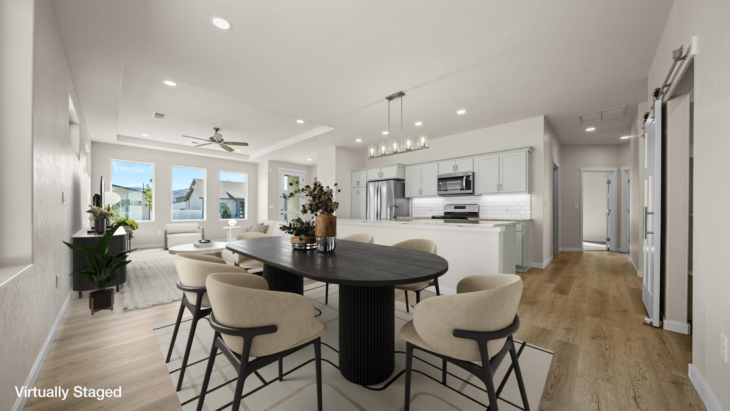 1705 Tungsten Way Fruita, CO 81521 - Photo 9 of 34 a view of a dining room with furniture and wooden floor