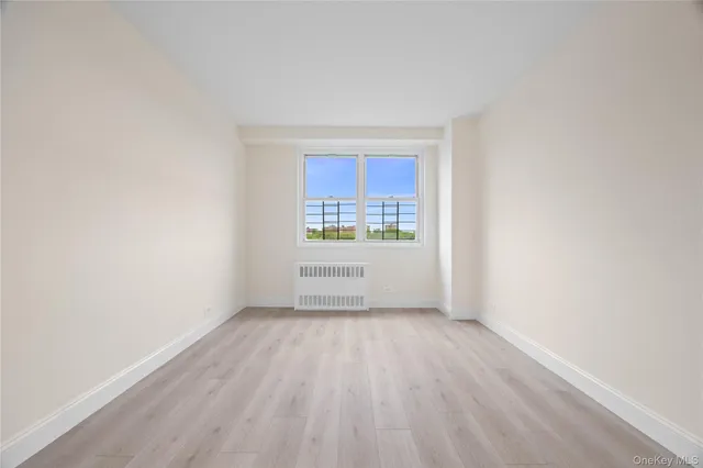 a view of an empty room and a window