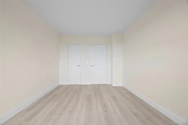 a view of room with wooden floor