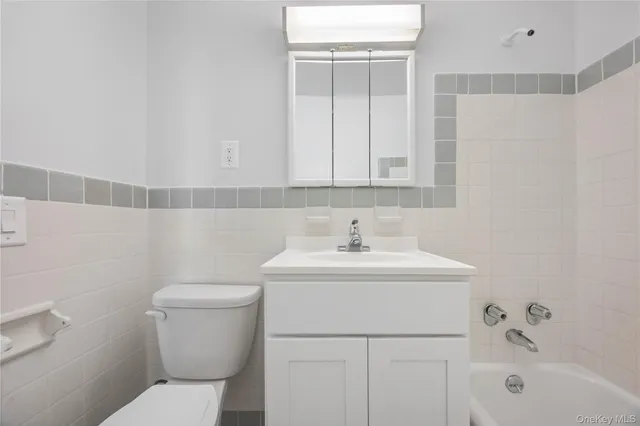 a bathroom with a sink toilet and vanity