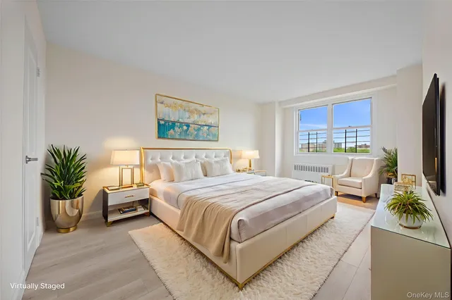 a bedroom with a large bed and a couch