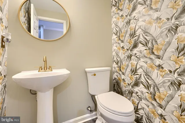 a bathroom with a toilet and a sink