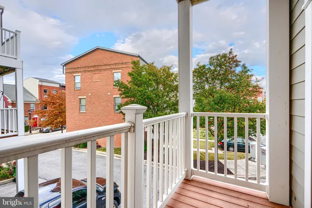 a view of a brick house with a large window