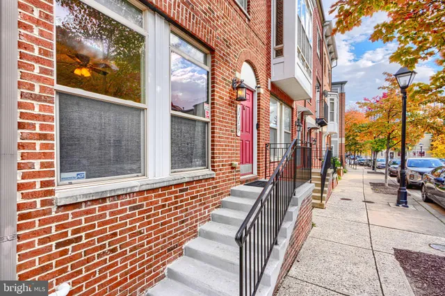 a view of a brick building with stairs