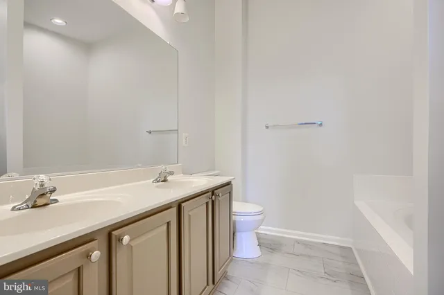 a bathroom with a shower and a bath tub