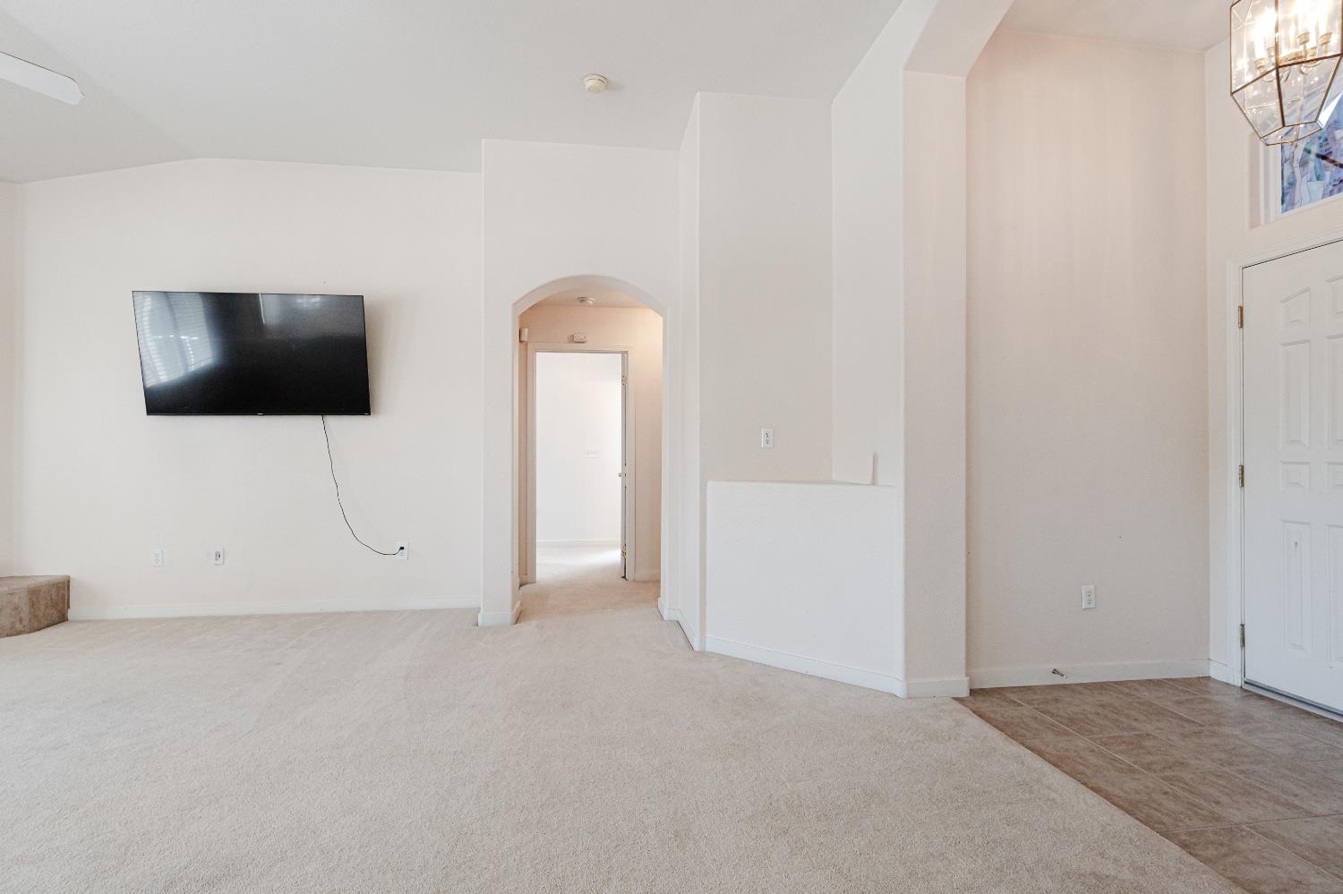 721 Via Cerioni Madera, CA 93637 - Photo 17 of 24 a view of a livingroom with an empty space and a flat screen tv