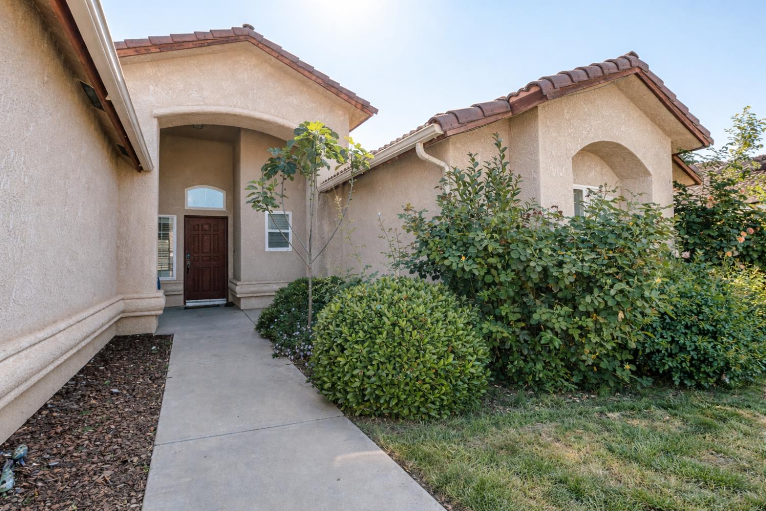 721 Via Cerioni Madera, CA 93637 - Photo 2 of 24 a view of a house with a yard