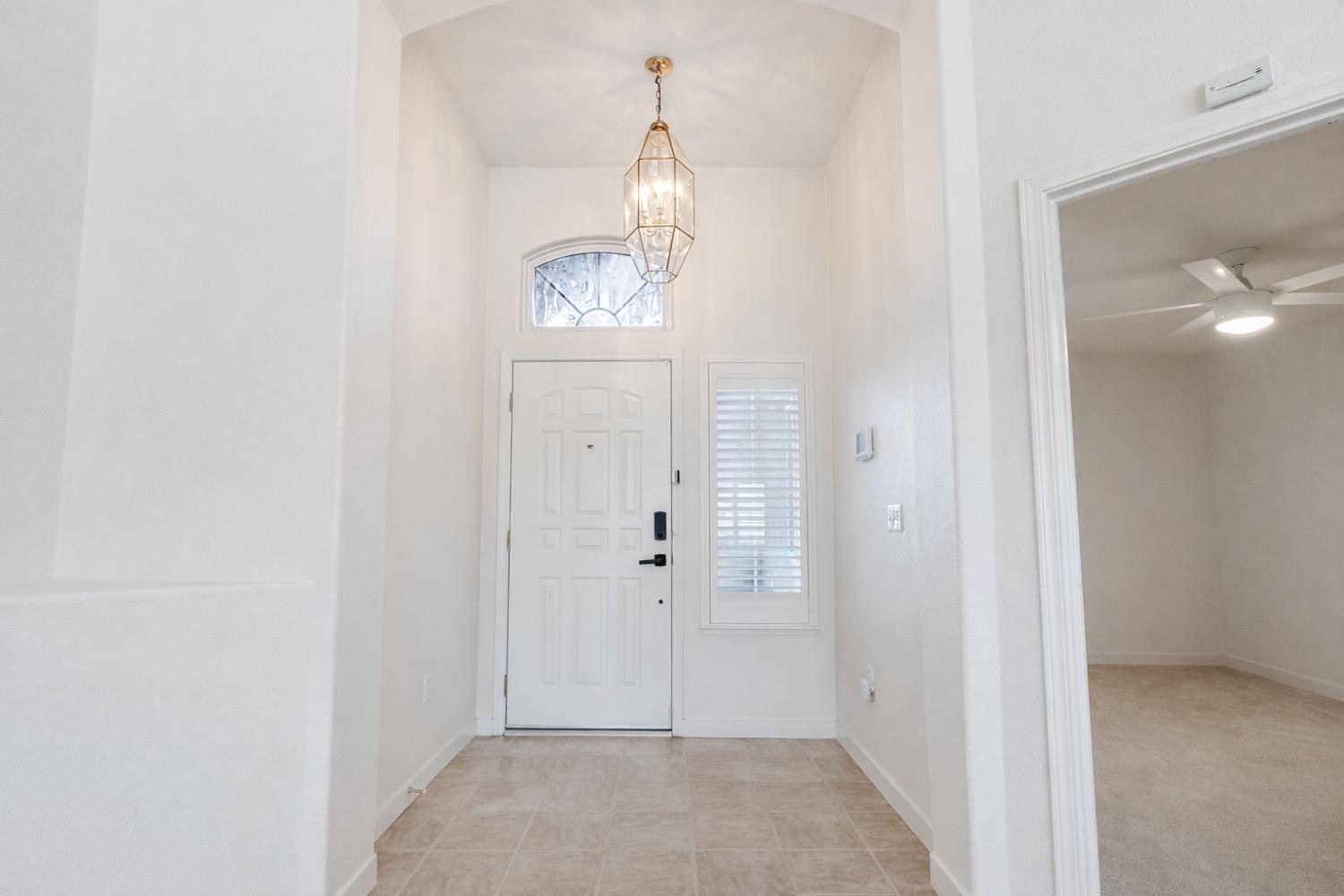 721 Via Cerioni Madera, CA 93637 - Photo 7 of 24 an empty room with mirror