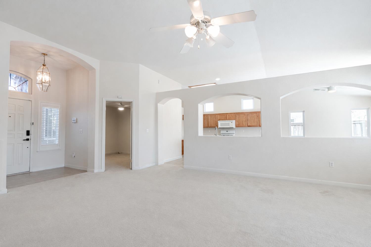 721 Via Cerioni Madera, CA 93637 - Photo 9 of 24 an empty room with fan and entrance