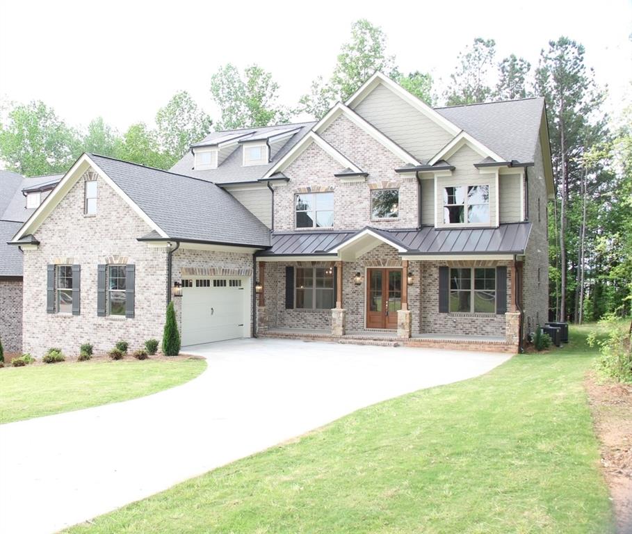 4329 Old Hamilton Mill Road Buford, GA 30518 - Photo 1 of 1 House front with a side entry garage, 2 1/2 spaces