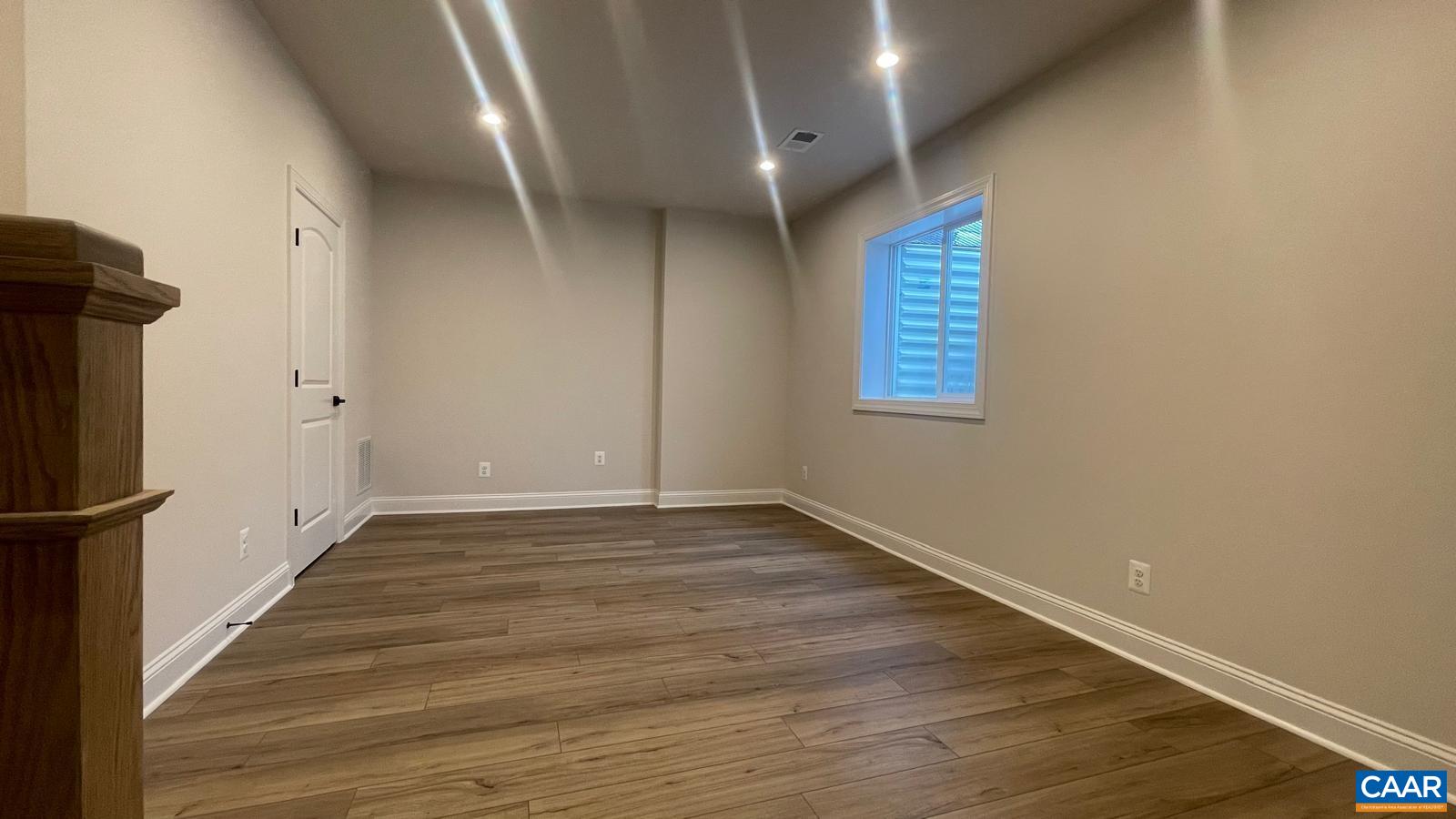 4006 Varick Street Charlottesville, VA 22901 - Photo 28 of 33 a view of an empty room with wooden floor and a window