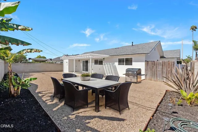 a terrace of a house with outdoor seating