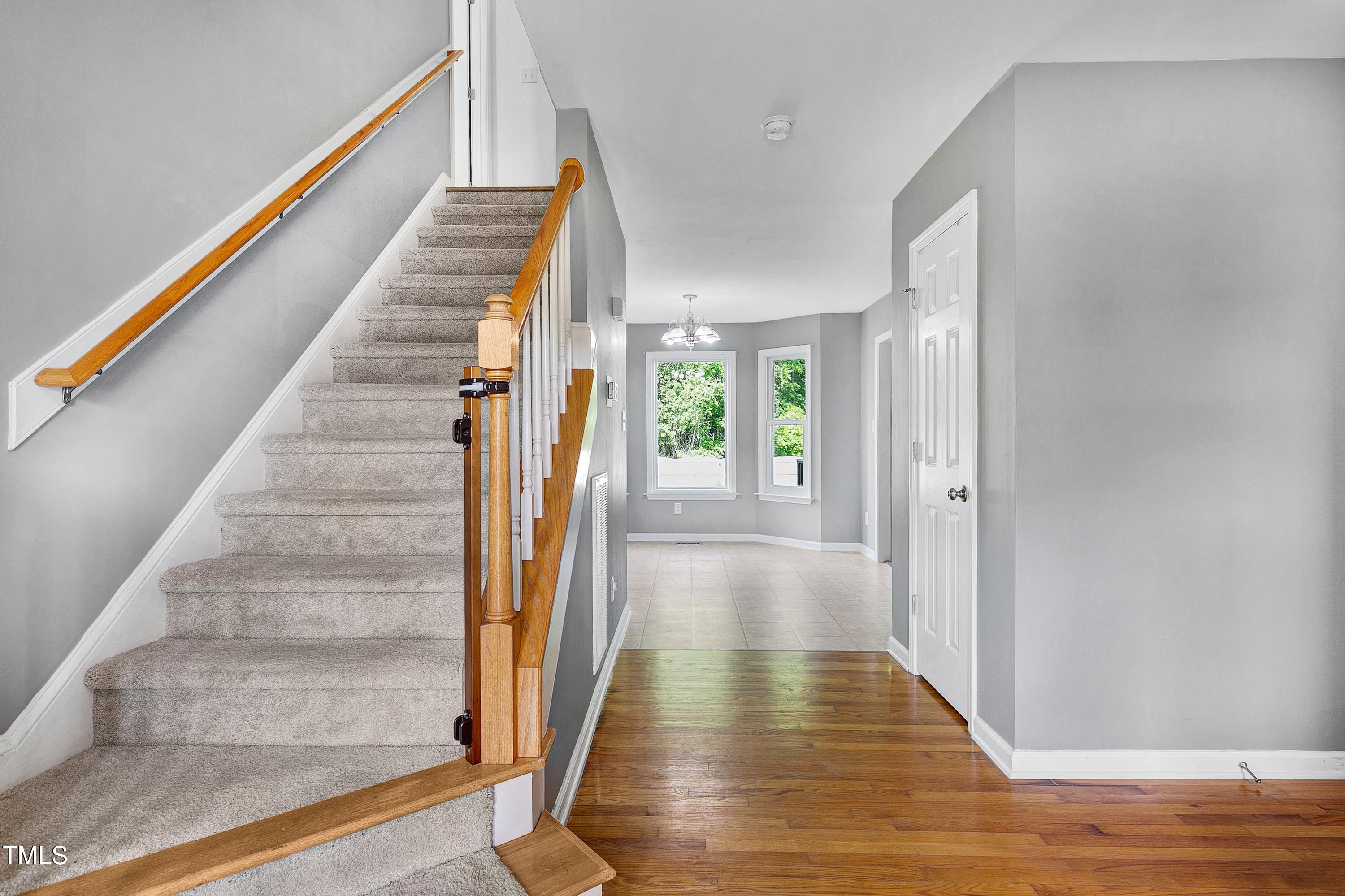 128 Lee Trace Drive Smithfield, NC 27577 - Photo 13 of 33 a view of an entryway with wooden floor and staircase