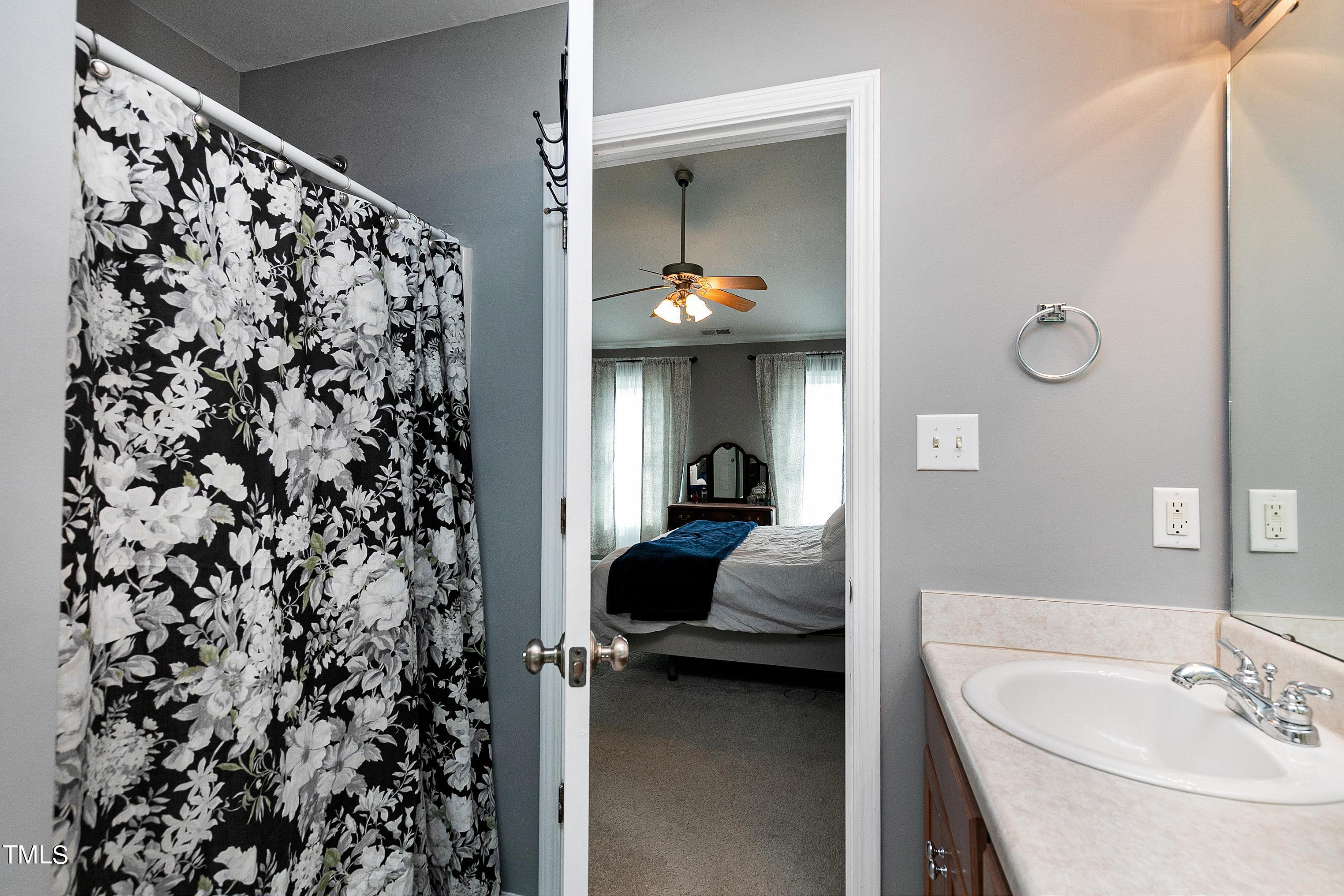 128 Lee Trace Drive Smithfield, NC 27577 - Photo 17 of 33 a en suite bathroom with a sink and a mirror