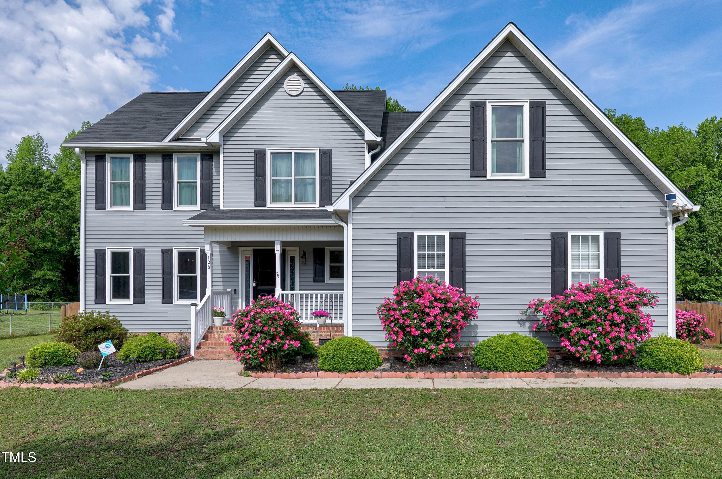 128 Lee Trace Drive Smithfield, NC 27577 - Photo 2 of 33 a front view of a house with a yard