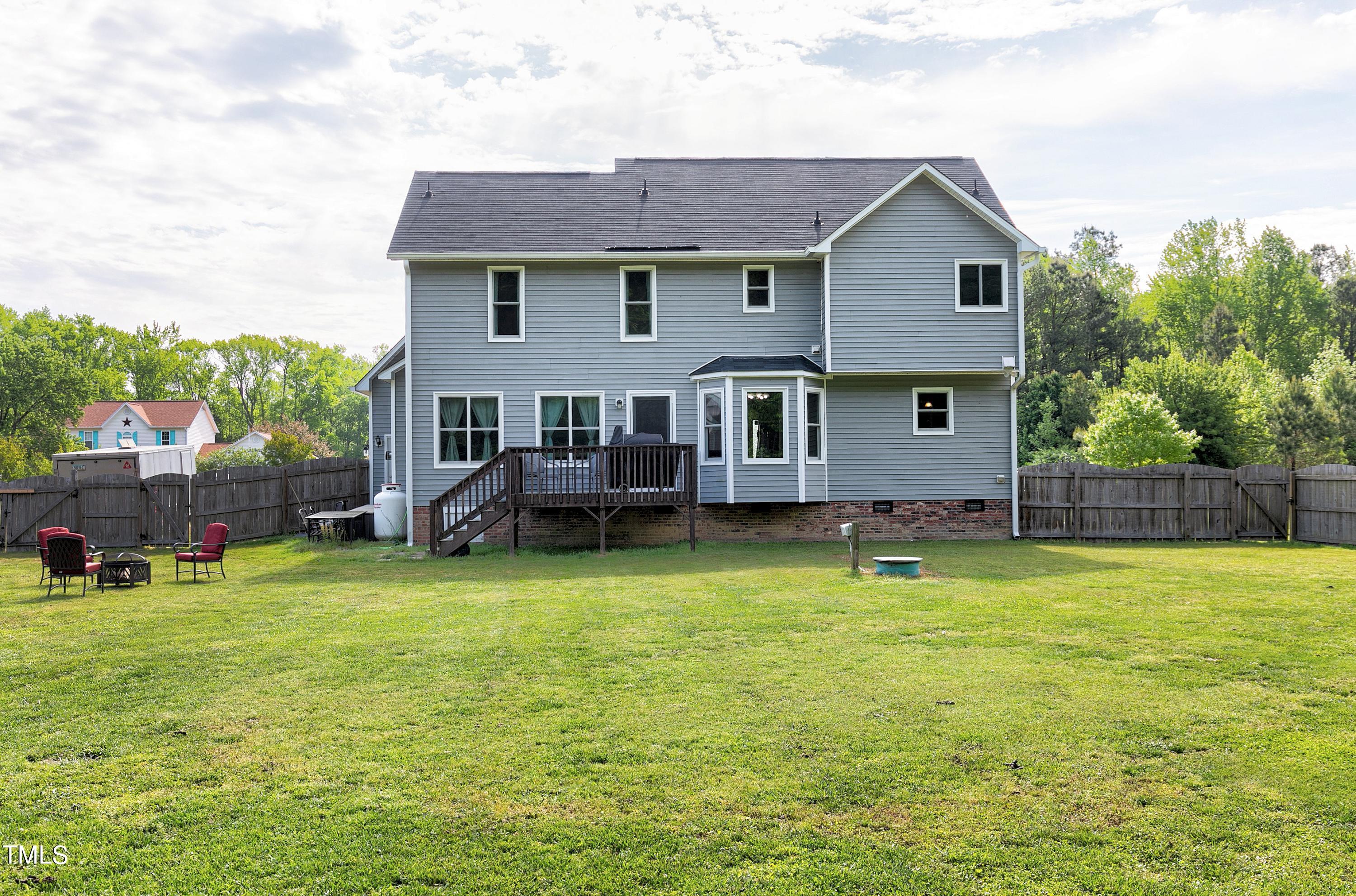 128 Lee Trace Drive Smithfield, NC 27577 - Photo 27 of 33 a view of a house with swimming pool and a yard