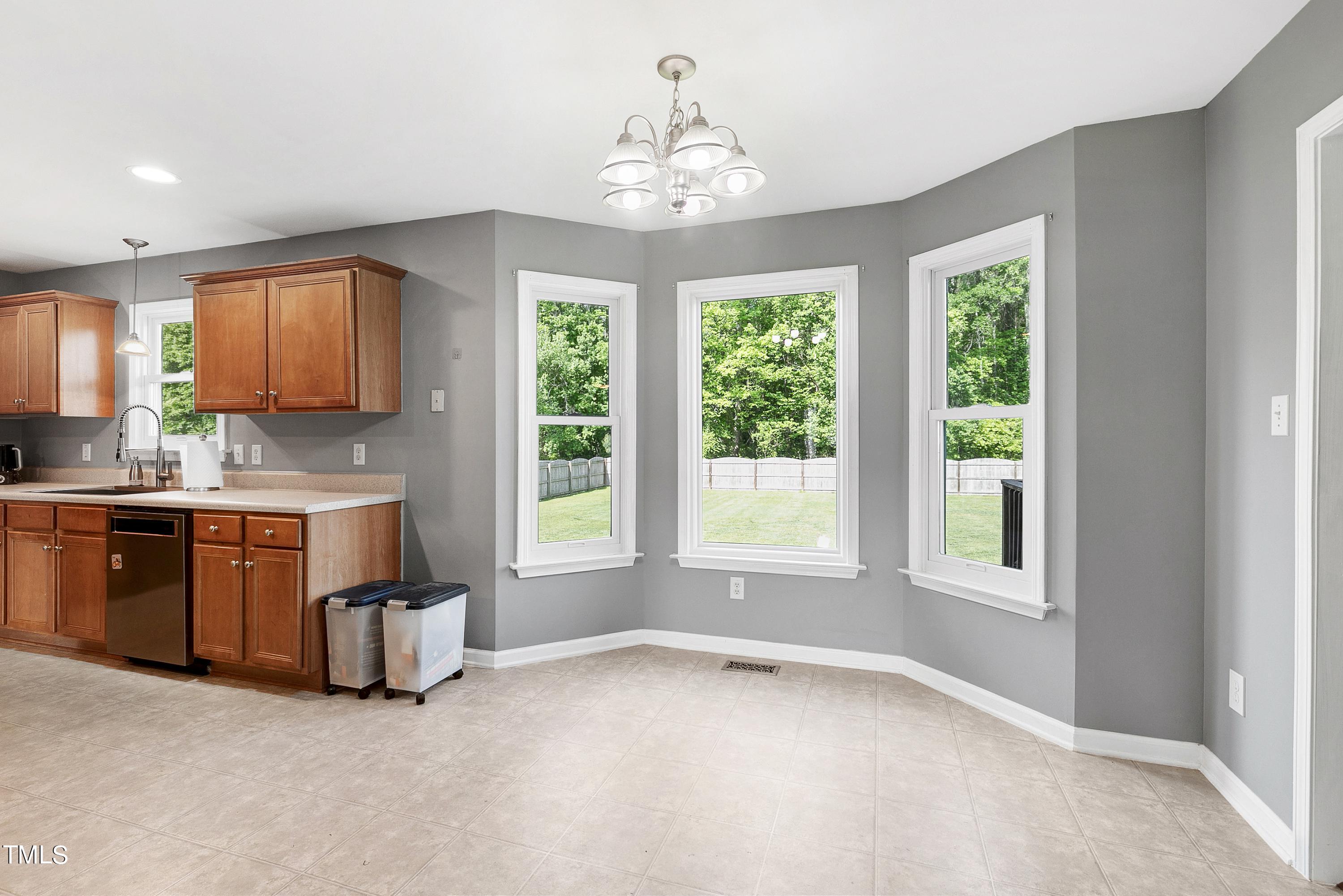 128 Lee Trace Drive Smithfield, NC 27577 - Photo 9 of 33 a kitchen with granite countertop a stove and a sink