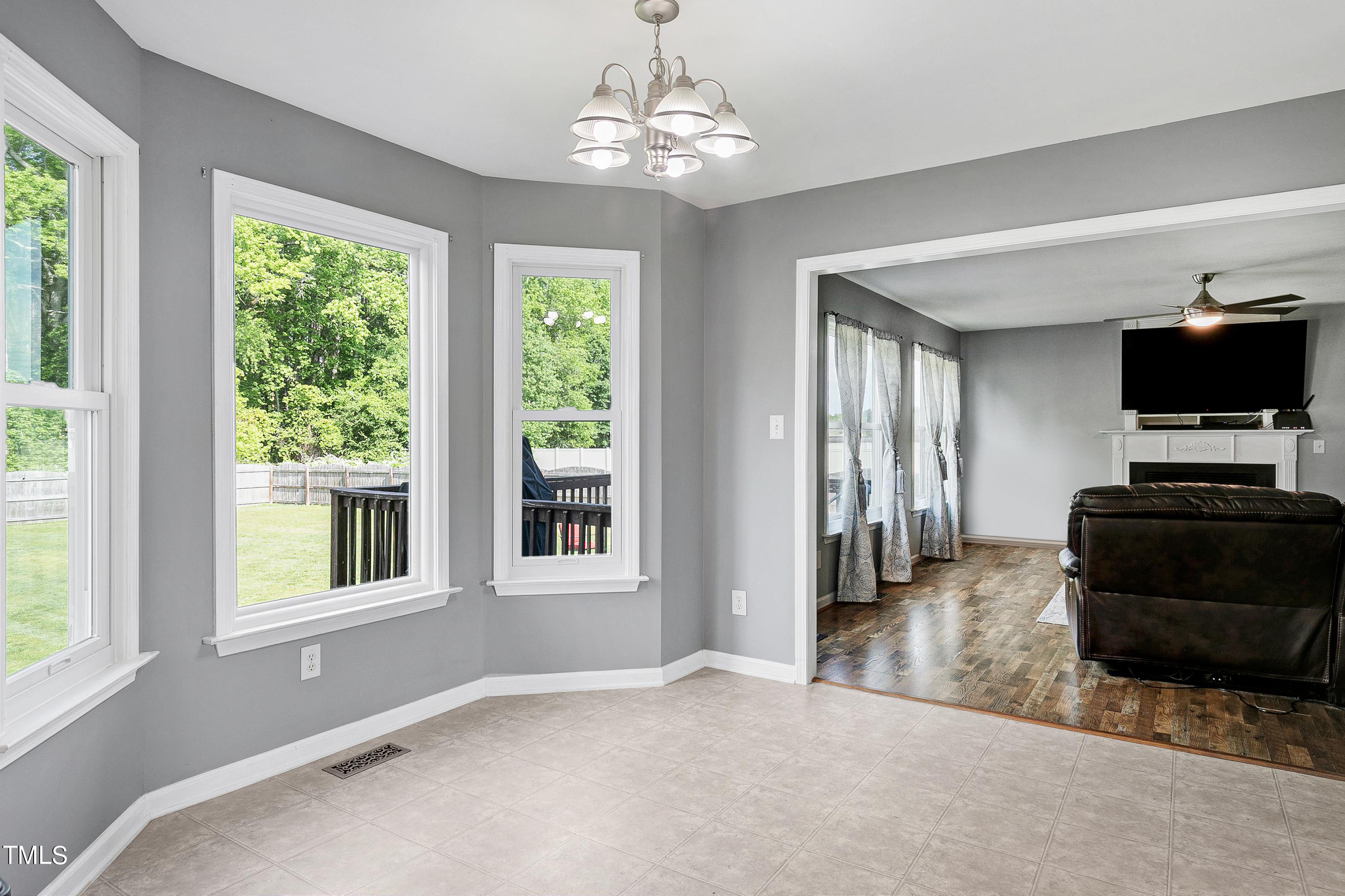 128 Lee Trace Drive Smithfield, NC 27577 - Photo 10 of 33 a living room with furniture and a flat screen tv