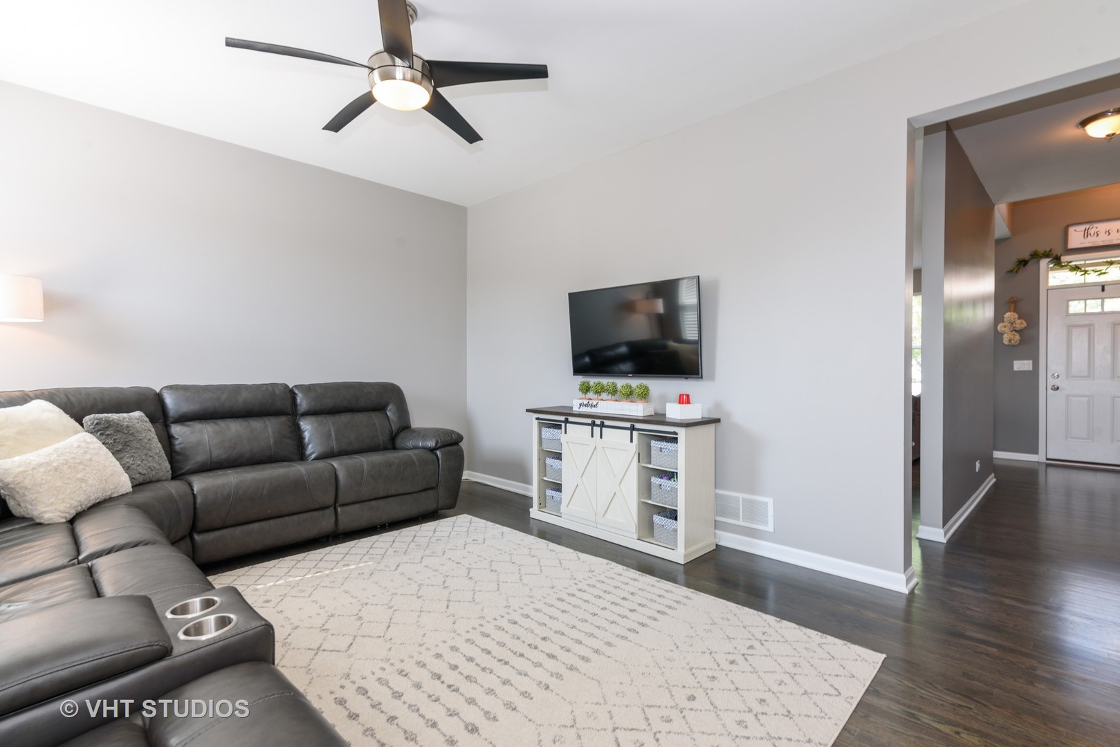 858 Oak Ridge Boulevard Elgin, IL 60120 - Photo 6 of 16 a living room with furniture and a flat screen tv