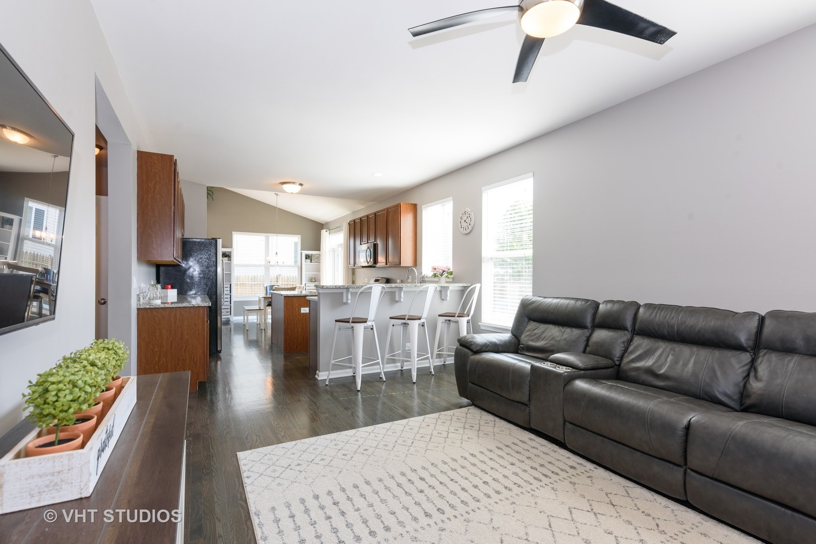 858 Oak Ridge Boulevard Elgin, IL 60120 - Photo 7 of 16 a living room with furniture wooden floor and a large window