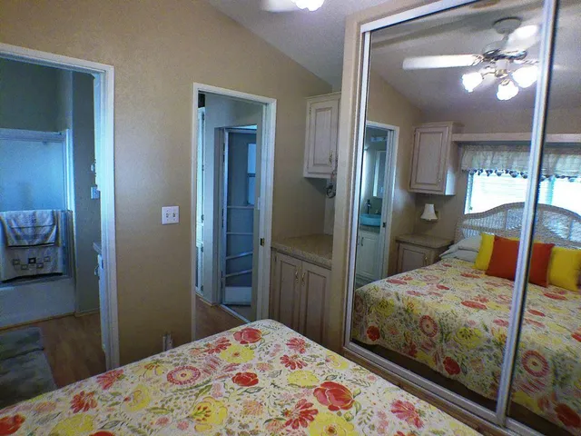 a bedroom with a bed and a dresser