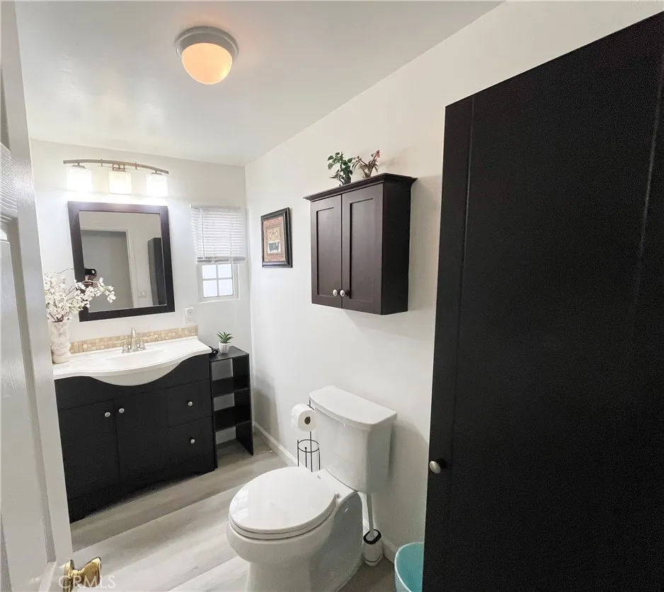 17700 Avalon, Unit 40 Carson, CA 90746 - Photo 23 of 33 a bathroom with a toilet sink vanity granite and mirror