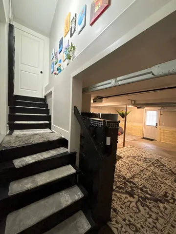 a bedroom with bed and window