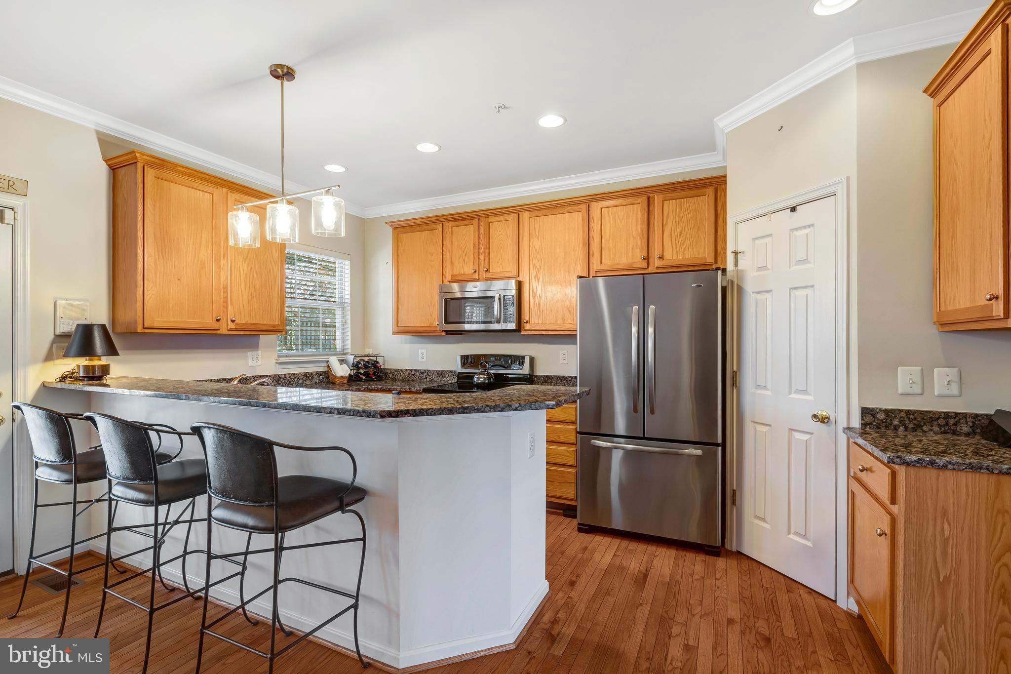 11022 Hemingway Court Silver Spring, MD 20902 - Photo 4 of 32 Gourmet kitchen with stainless steel appliances.