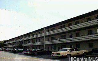 617 McNeill Street, Unit 302 Honolulu, HI 96817 - Photo 1 of 1 a front view of building with cars parked