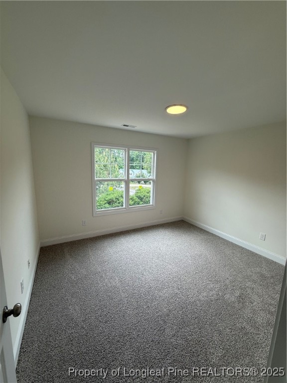 81 Reece Drive Sanford, NC 27332 - Photo 17 of 18 an empty room with windows