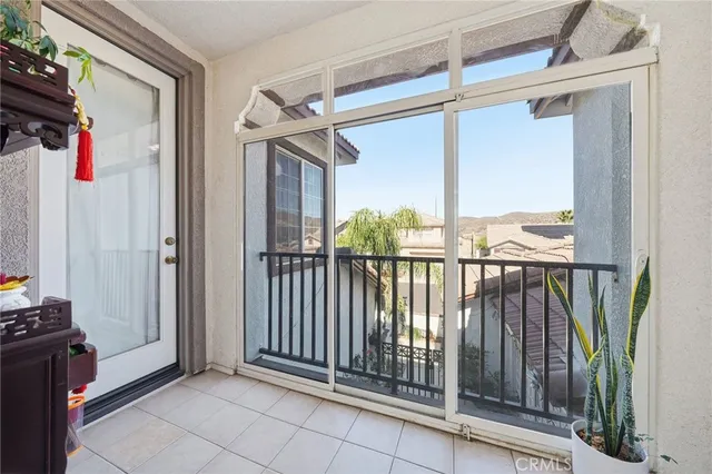a spacious bedroom with a bed and a window