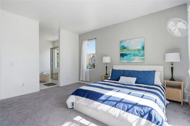 a spacious bathroom with a shower sink and mirror