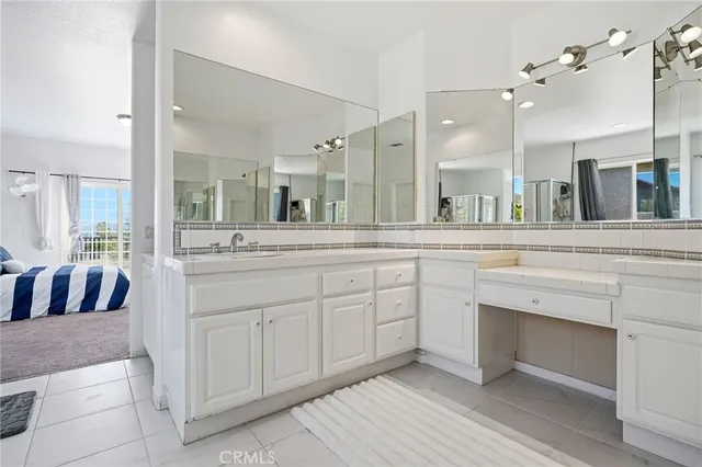 a spacious bathroom with a bathtub and a shower