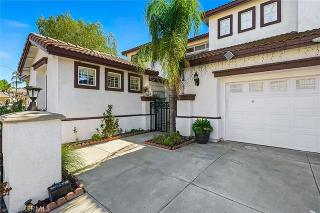 a view of a patio with table and chairs with wooden floor and fence