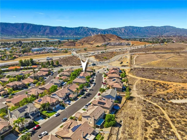 an aerial view of residential houses and outdoor space