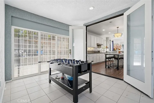 a living room with granite countertop furniture and a floor to ceiling window