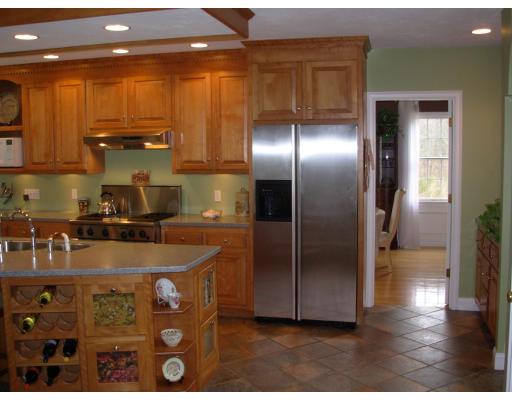 15 Deer Ridge Road Ashland, MA 01721 - Photo 7 of 24 a kitchen with a refrigerator and wooden floor