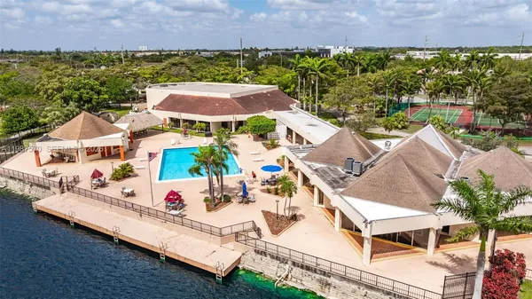 an aerial view of house with yard