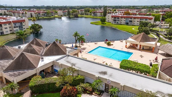 an aerial view of a house with a lake view
