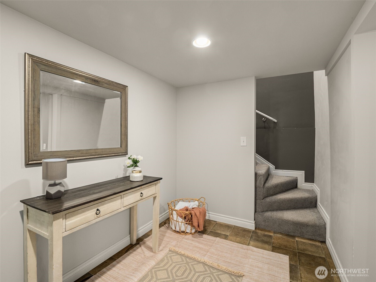 3928 South Pilgrim Street Seattle, WA 98118 - Photo 16 of 27 a bathroom with a granite countertop sink and a mirror