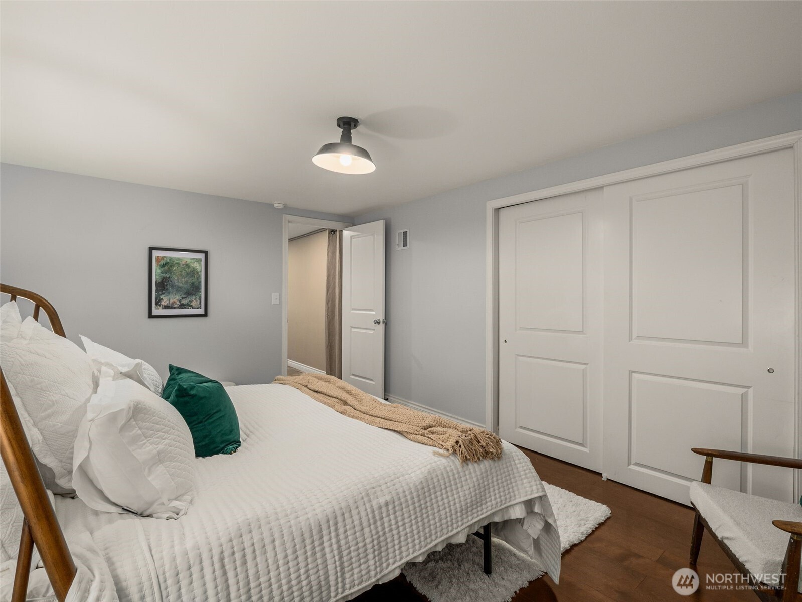 3928 South Pilgrim Street Seattle, WA 98118 - Photo 18 of 27 a bedroom with a bed and a table