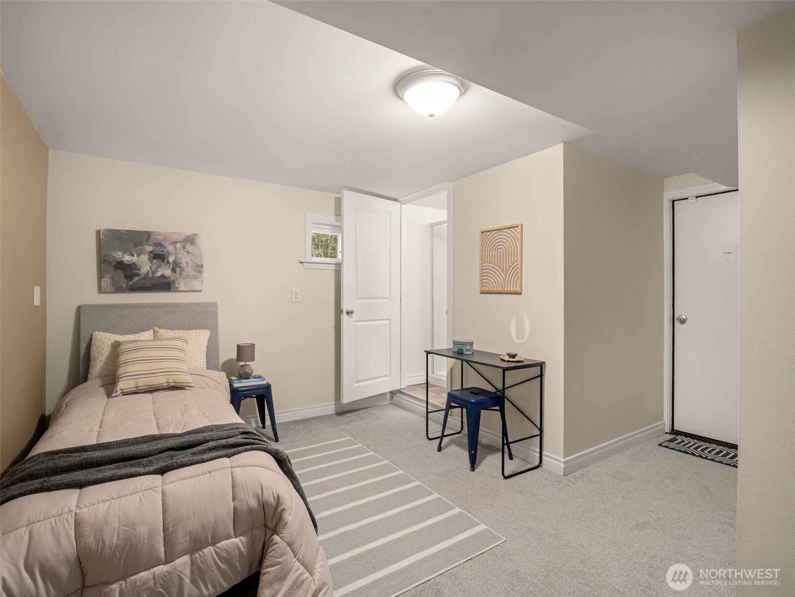 3928 South Pilgrim Street Seattle, WA 98118 - Photo 19 of 27 a bedroom with a bed and wooden floor