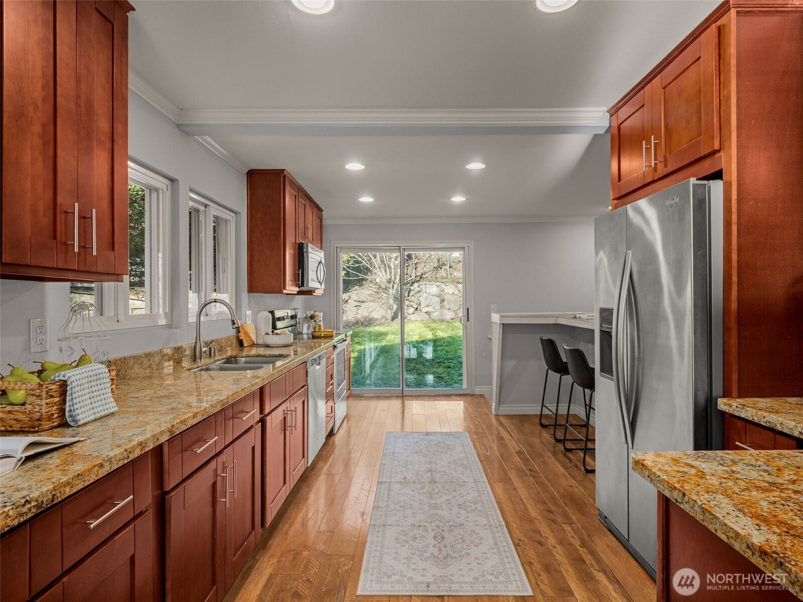 3928 South Pilgrim Street Seattle, WA 98118 - Photo 10 of 27 a kitchen with a sink stove and refrigerator